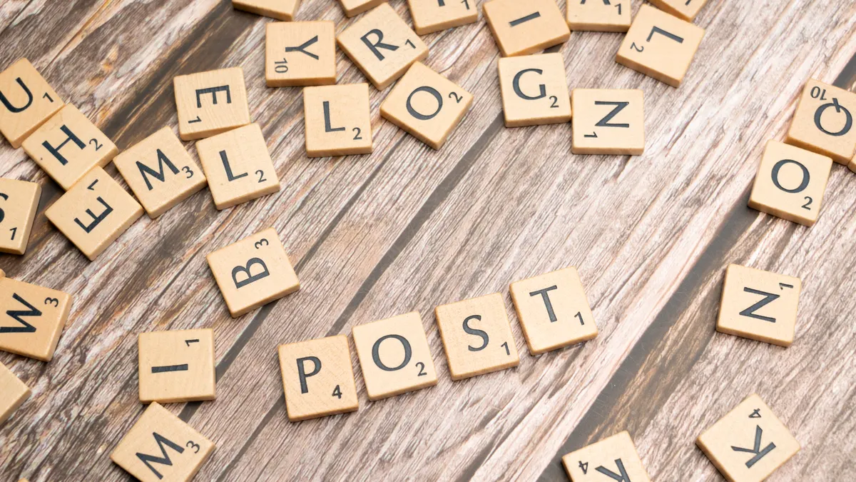 How do you connect AI writing tools to WordPress publishing? — Scrabble letters spelling out the word post on a wooden t