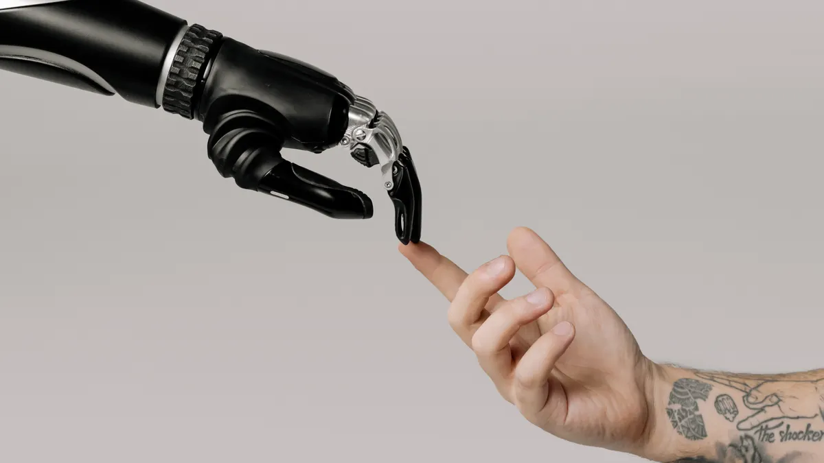 How does human review improve automated blog publishing? — Bionic Hand and Human Hand Finger Pointing
