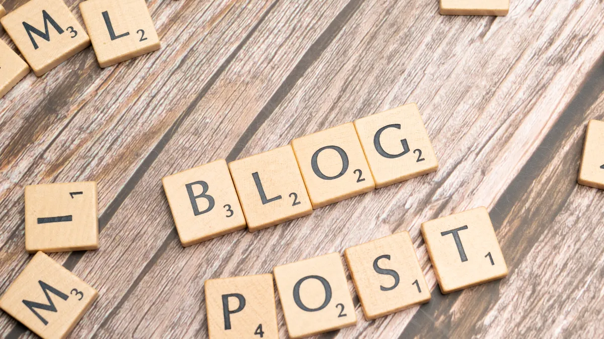 How does human review improve automated blog publishing? — Blog post with scrabble letters spelling out blog post