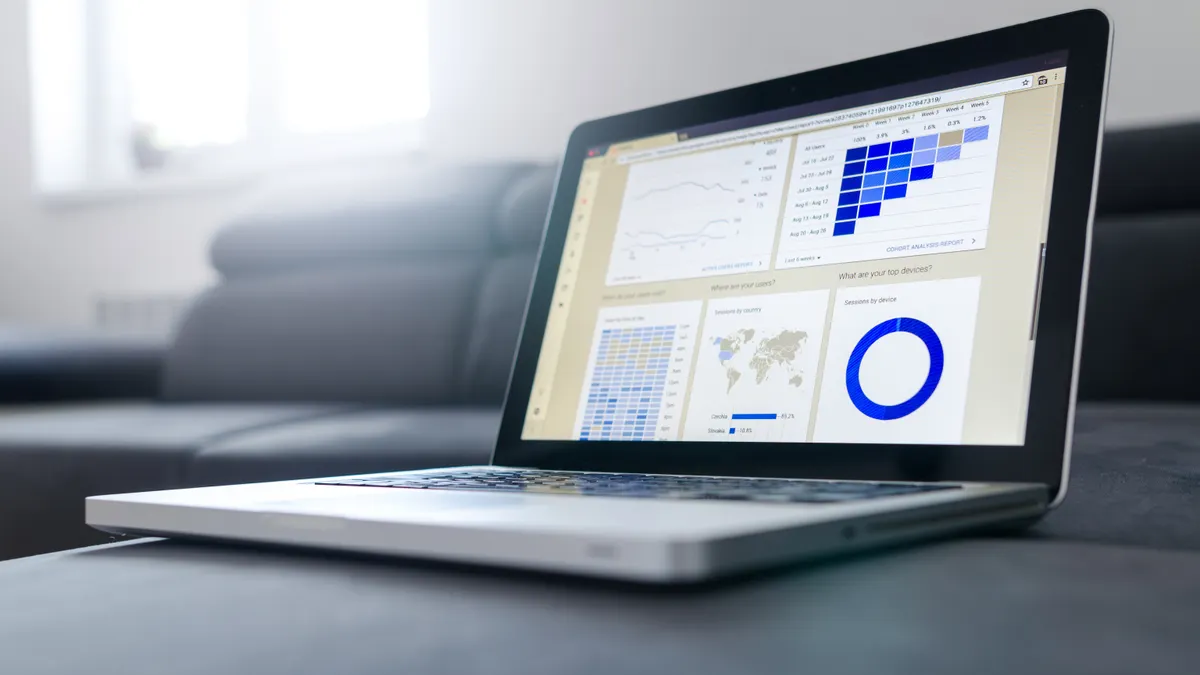 Laptop showing analytics charts and graphs